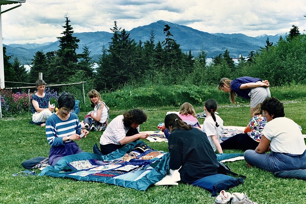 Women gather on the lawn of CBC Hill, Digby Island, for a quilting bee in 1993