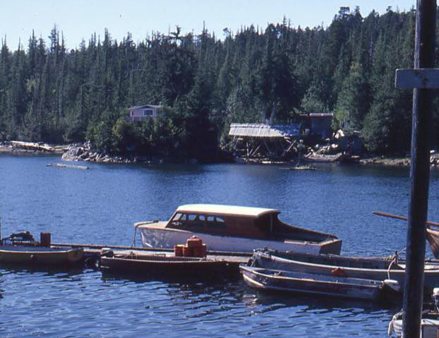 The dock at Salt Lakes, with boatshed and cabin on far shore.