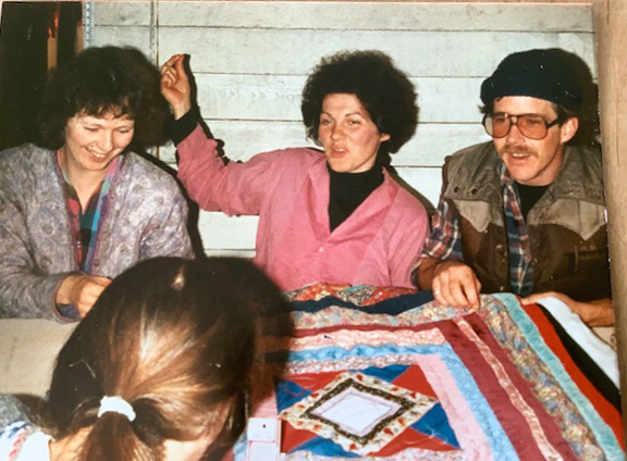 A man occasionally joined the quilting circle.
