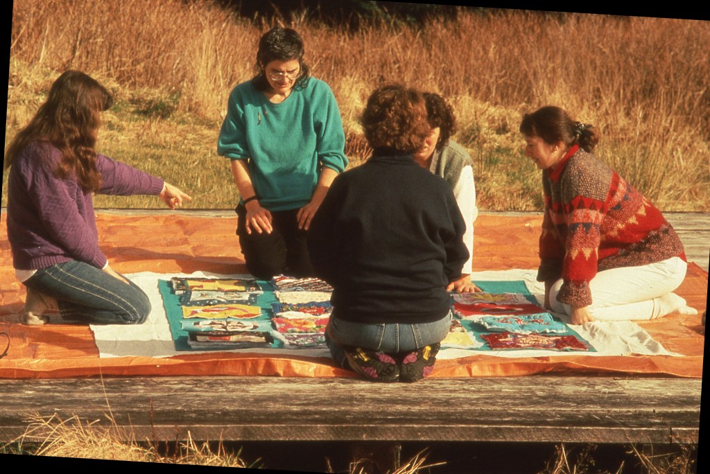 We are laying out the squares for Kim's quilt, using the helicopter pad on CBC Hill as our worktable.